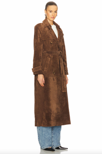 Elevate your style with the Corrin Suede Trench Coat by Ducie. Crafted from luxurious suede leather, this double breasted trench is complete with a storm flap and leather sash for a sophisticated touch. Its cocooning design and satin lining make it a timeless addition to your wardrobe.