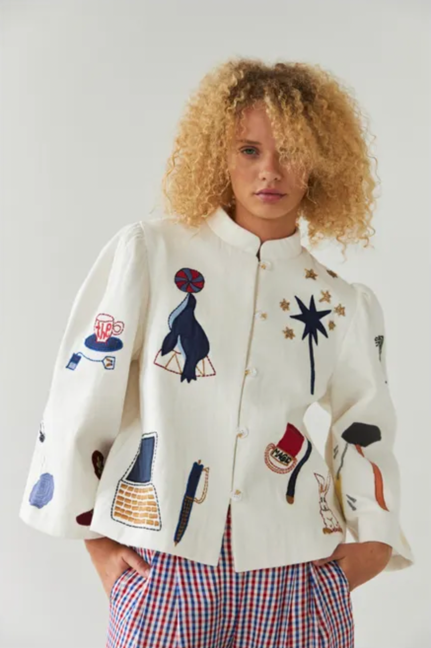 This circus embroidered jacket by Stella Nova features a unique print on both the front and back, making it a standout piece in your wardrobe. The crew neck and long, wide sleeves provide both comfort and style. With a front button closure, this jacket is perfect for any occasion.