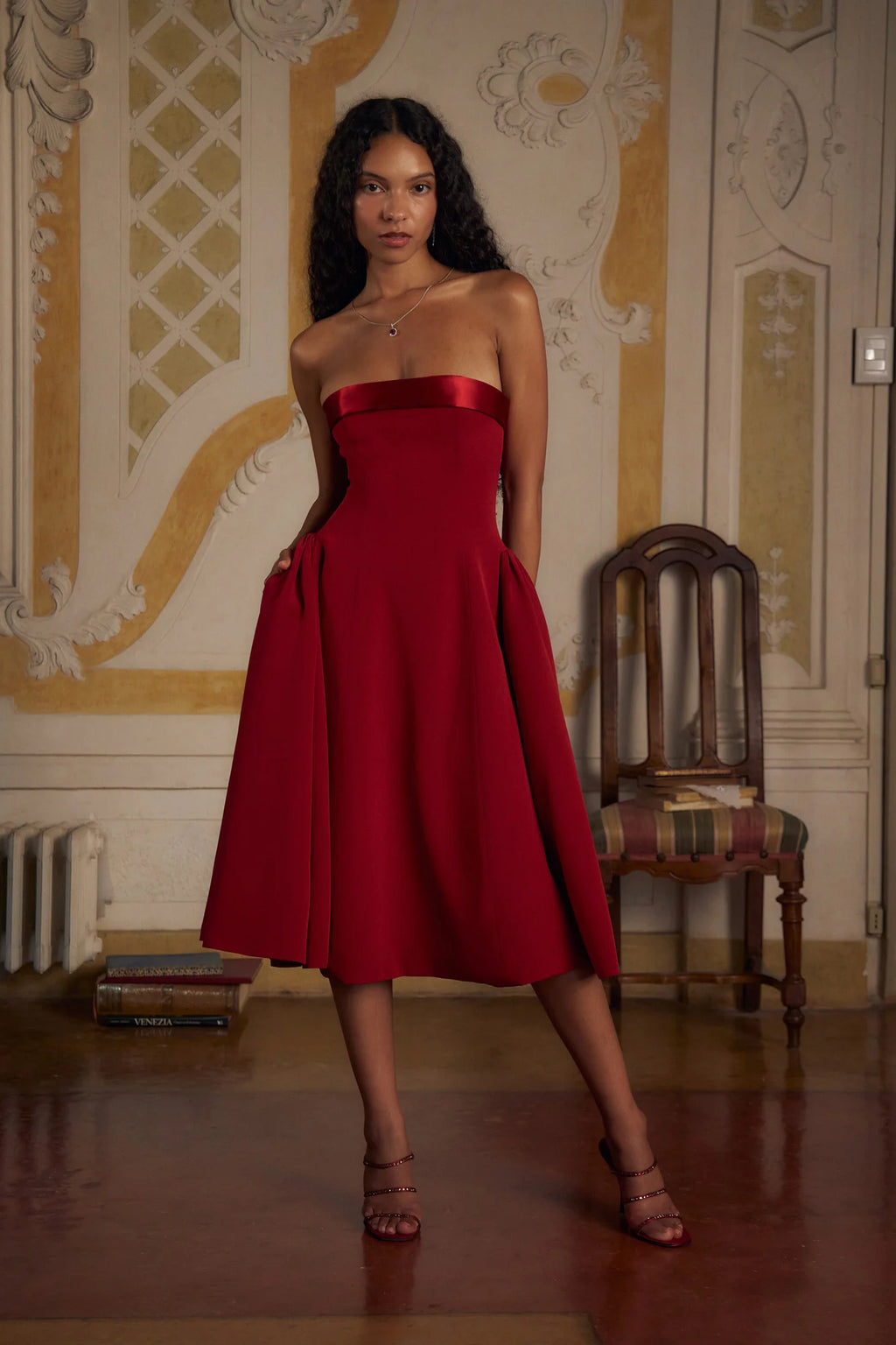 Indulge in luxury with the Scarlet Charmeuse Dress. This strapless, lady length dress boasts a fold over collar in silk charmeuse and a built-in inner bodice with silicone gripper elastic. Equipped with godets at the high hip and invisible zipper, it offers both style and convenience. Feel chic and confident with this elegant dress.