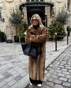 Elevate your style with the Daphne Shearling Coat. This faux fur masterpiece seamlessly blends textures and patterns for a luxurious and sophisticated aesthetic. The camel-colored coat not only adds warmth but also exudes opulence. Make a statement and elevate your wardrobe with this must-have piece.