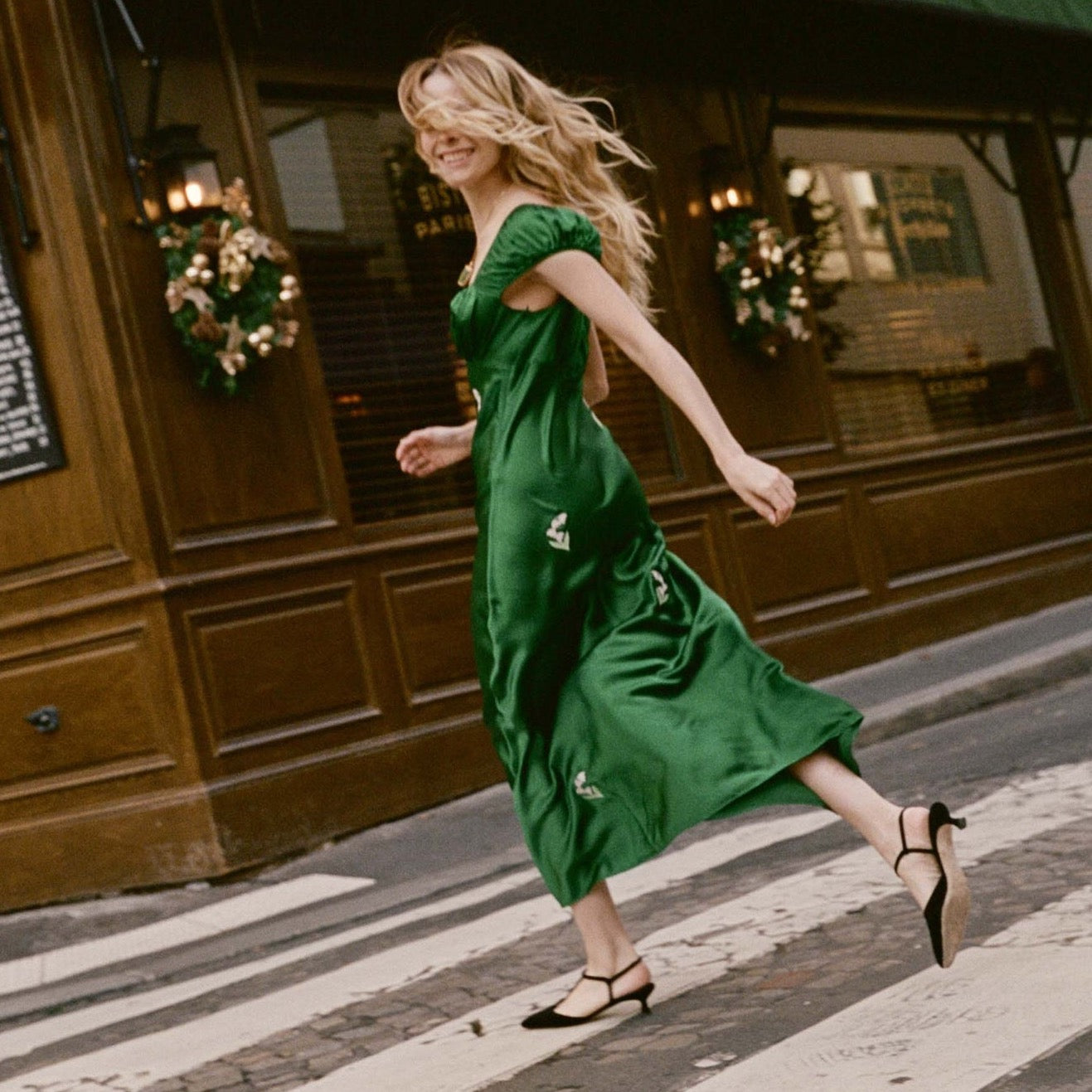 Rendered in buttery garment-washed silk satin and adorned with embroidered lily of the valley appliqués, the ‘30s-inspired Gwendolyn Dress features puffed cap sleeves, a sweetheart-style neckline, and a gathered bust. A fitted waist with an invisible side zipper gives way to an ankle-grazing bias-cut skirt.