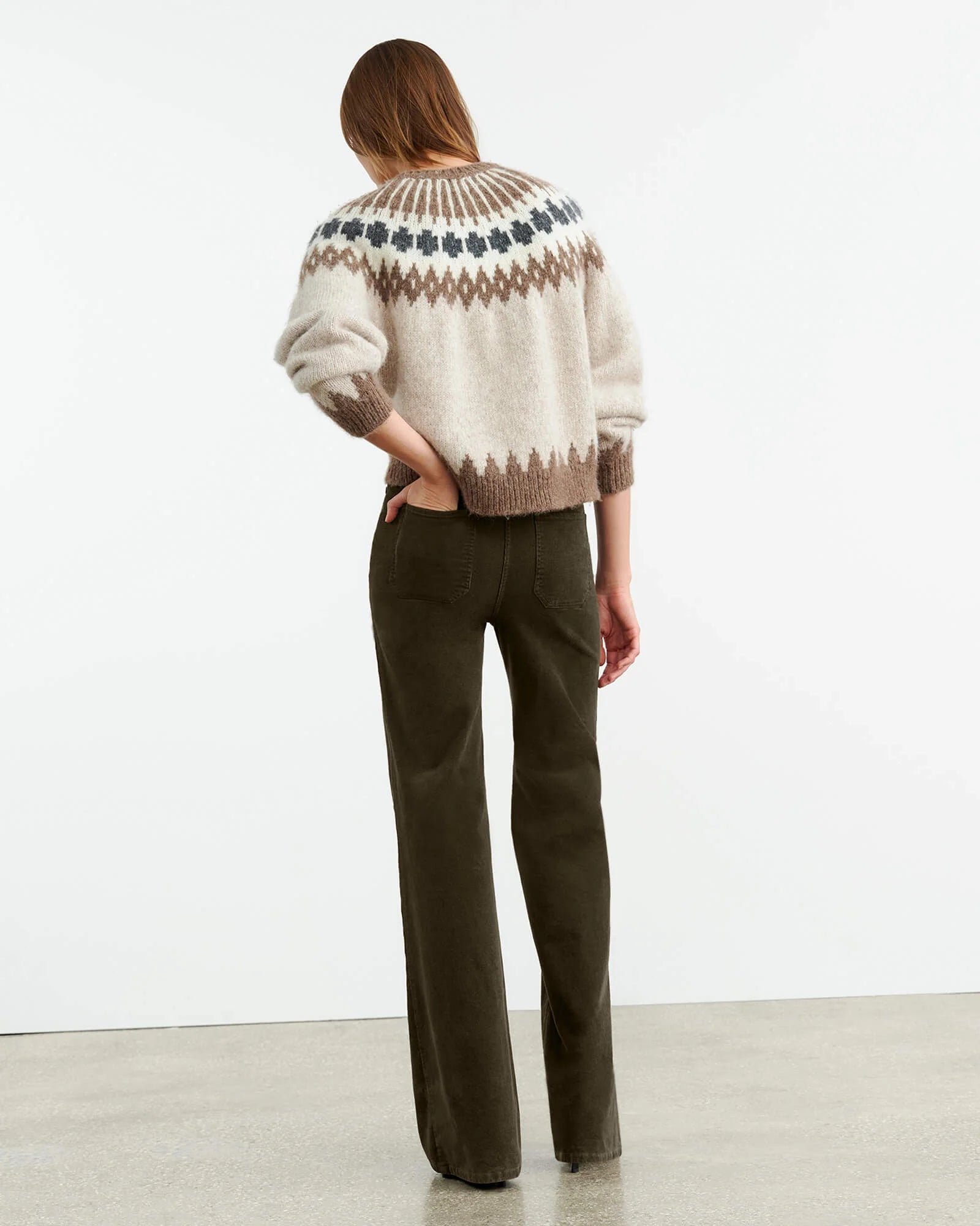 Indulge in luxury with our Alena Jersey by Nili Lotan. Crafted from Italian alpaca wool, this chunky weight fair sweater features a raglan sleeve and ribbed detailing at the hem and neck. The single layer rib design adds a touch of elegance to this boxy silhouette. Stay warm and stylish all winter long.