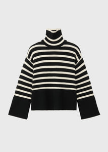 Unleash your fashion-forward style with the Striped Wool Jersey by Toteme. Crafted from heavyweight wool and organic cotton, this turtleneck sweater boasts a striking sand and black striped pattern. Certified by the Responsible Wool Standard, its boxy silhouette, tall neck, and extra-long sleeves with dropped shoulders exude luxury and sophistication. Leave the neck undone for an effortlessly chic look.