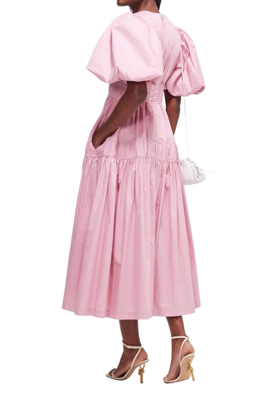 Elevate your special occasion look with the Fallingwater Ruched Midi Dress by AJE. Made from sweet 'Chalk Pink' cotton-poplin, this dress boasts a romantic and playful silhouette with voluminous puffed sleeves and a cinched waist. Rent now to make a stand-out statement!