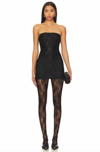 Expertly crafted in England, the Bruna Dress offers effortless elegance with its pull-on styling and delicate lace fabric. Hand washable for easy maintenance, it also features attached lace tights lining for a touch of femininity. Perfect for any occasion, its strapless design adds a touch of sophistication to your wardrobe.