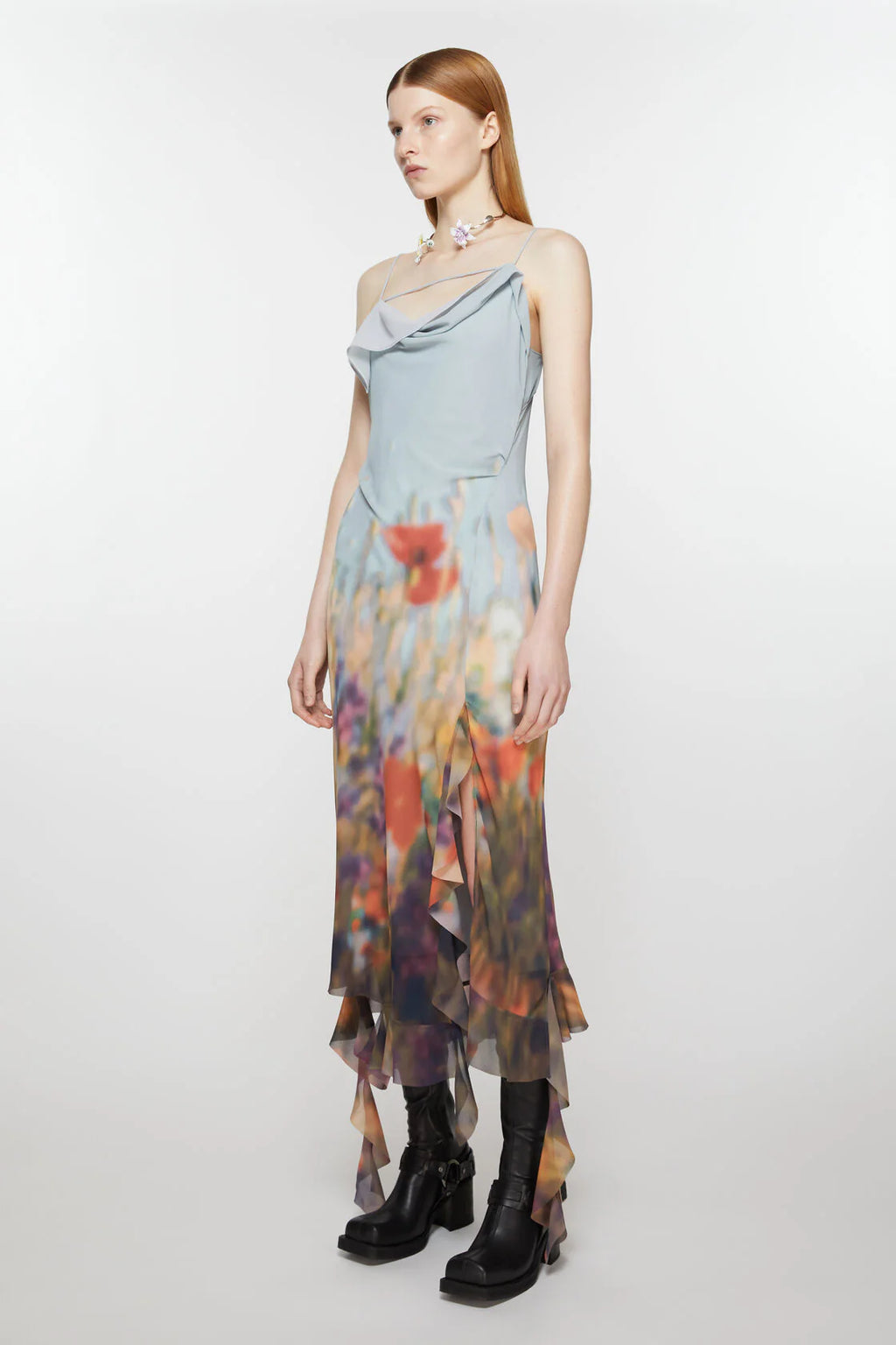 Indulge in pure elegance with the Ruffle Strap Dress from Acne Studios. The unique, draped hem adds a touch of whimsy to the fitted silhouette, while the seasonal blurred meadow print brings a refreshing touch. The semi-sheer fabric and tie closure give off an alluring vibe, perfect for any occasion.