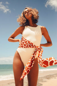 Be bold and take a risk with the Fenne Swimsuit! This one-piece swimsuit for women features a sexy zipper and belt, making a statement on the beach or by the pool. Unleash your adventurous side with this daring addition to your swimwear collection!