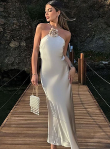 Introducing the Samantha Dress, a stunning addition to your wardrobe. Crafted from luxurious white satin, this elegant dress exudes sophistication and grace. Perfect for special occasions, it's the perfect choice for those looking to make a statement. Elevate your style with the Samantha Dress.