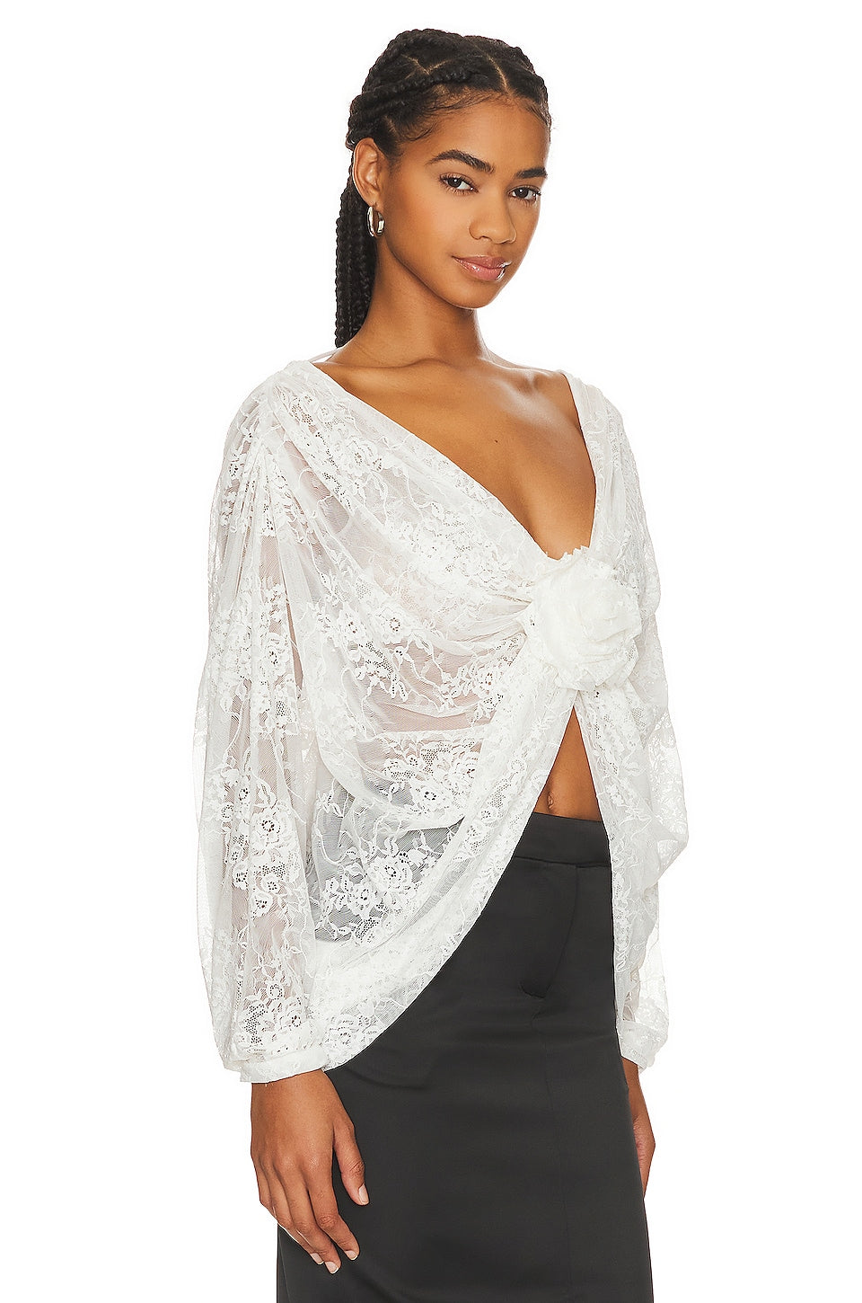 "Elevate your style with our Milk White Blouse Madeline. This sophisticated top boasts floral applique for a subtle, feminine touch and chic batwing sleeves. A must-have for any exclusive event or night out, this wrap lace top, handcrafted by Giussepe di morabito with %100 premium material, exudes luxury and class."