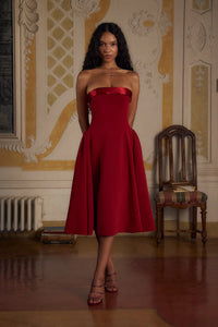 Indulge in luxury with the Scarlet Charmeuse Dress. This strapless, lady length dress boasts a fold over collar in silk charmeuse and a built-in inner bodice with silicone gripper elastic. Equipped with godets at the high hip and invisible zipper, it offers both style and convenience. Feel chic and confident with this elegant dress.