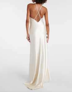 This Roland Mouret's Embellished Satin Gown exudes timeless sophistication. Made of luxurious silk satin, it features a stunning open back with lace-up detail and elegant A-Line silhouette. Perfect for any special occasion, this halter gown is designed to make you feel confident and beautiful.