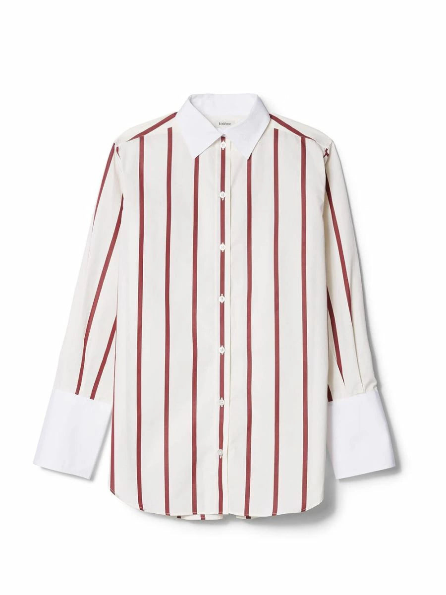 The Sassa Oversized Striped Cotton-poplin from Toteme is a must-have for any fashion-forward individual. Its luxurious cotton-poplin material and oversized fit exude sophistication and exclusivity. Elevate your wardrobe with this stylish and versatile shirt that is perfect for any occasion.