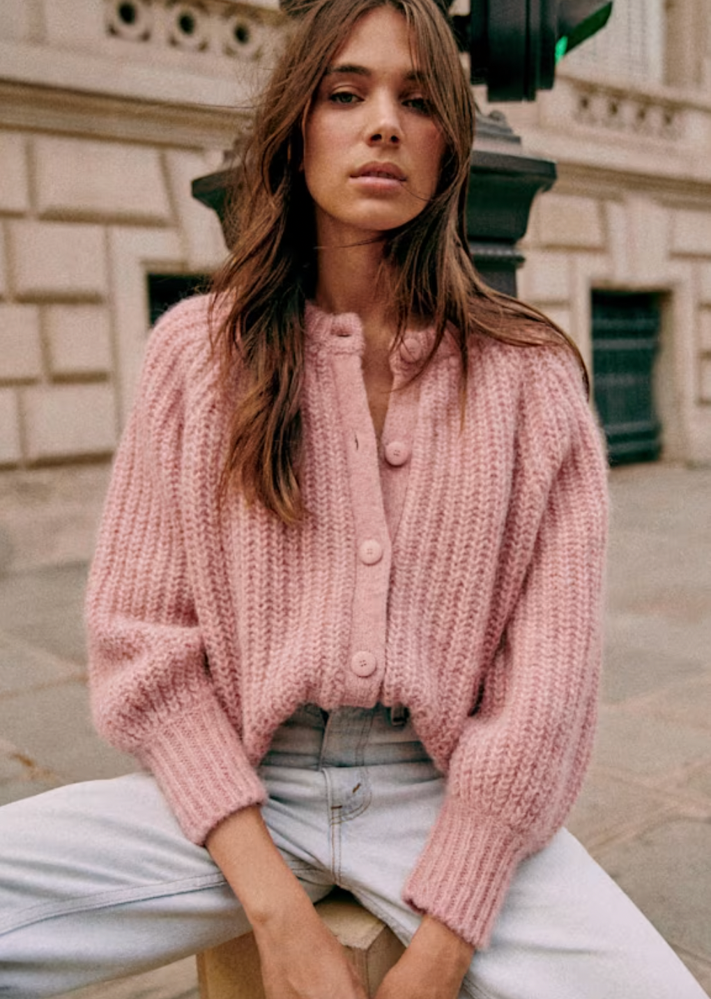 Indulge in the luxurious comfort and style of the Cardigan Emile. Crafted from a blend of alpaca and wool, this cardigan boasts long, slightly puffed sleeves and a beaded rib knit design. The round neckline and tone-on-tone buttons add an elegant touch to this slightly oversized piece, making it a must-have for any sophisticated wardrobe.