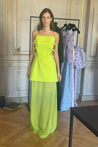 Feel effortlessly elegant in the Sleeveless Gown with Bow-Ties by AZZI & OSTA. With a structured bodice and thin straps, it boasts a square neckline, open back, and bow-tie details for added flair. The flowing georgette skirt and illusion design add a touch of whimsy. Perfect for special occasions. Imported, dry clean only. Available in neon green.