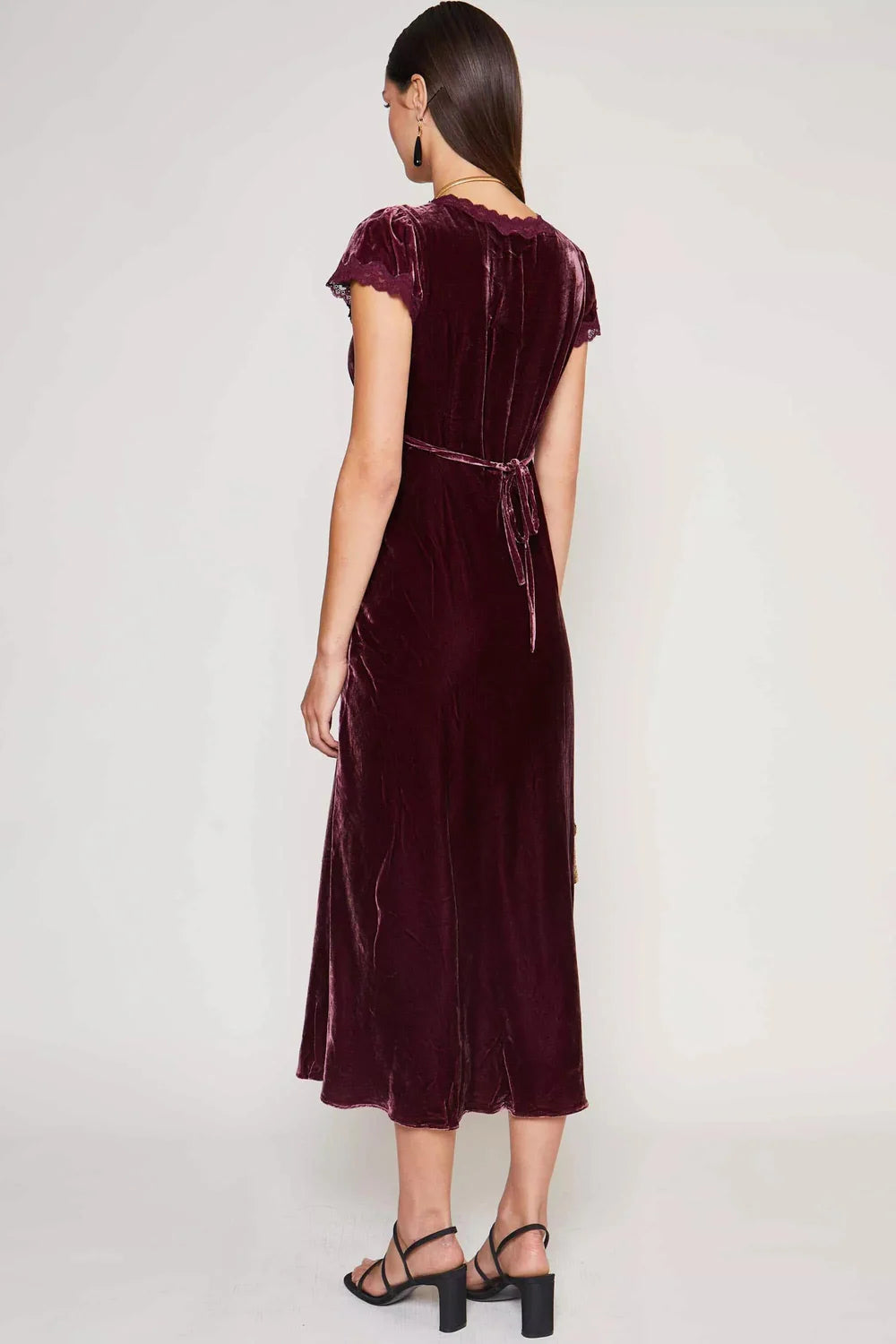 Elevate your evening look with the Clarice Velvet Midi Dress. Crafted from a lavish blend of silk and velvet, this dress exudes opulence and sophistication. Its soft texture and elegant silhouette make it the perfect choice for any party or special occasion. Turn heads and feel like a true VIP in this luxurious dress.