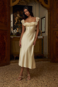 This elegantly designed Sonata Lady Length Dress features an off the shoulder neckline, adding a touch of femininity to your look. The bias cut of the dress and lace trim add a delicate and sophisticated touch. Designed for comfort and support, it includes silicone gripper elastic and boning on the upper bodice. Indulge in luxury and beauty with this dress!