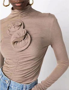 Indulge in the opulent elegance of this ruched floral-appliqué turtleneck top. Handcrafted with exquisite three-dimensional floral appliqués and pleated knit fabric, this high neck top exudes sophistication and luxury. Perfect for adding a touch of artistic flair to any outfit, plus enjoy free shipping with your purchase.