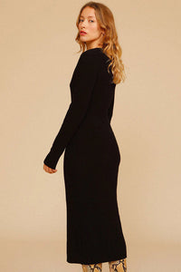 Experience effortless chic this autumn and winter with our Elona Midi Dress. Made from high-quality rib knit fabric, this vintage cutout dress features a figure-hugging silhouette, cascading cut-outs with bows, and a crew neckline. Perfect for work from home or dressing up on off-duty days. Complete the look with mid-calf heeled boots and a snakeskin baguette bag.