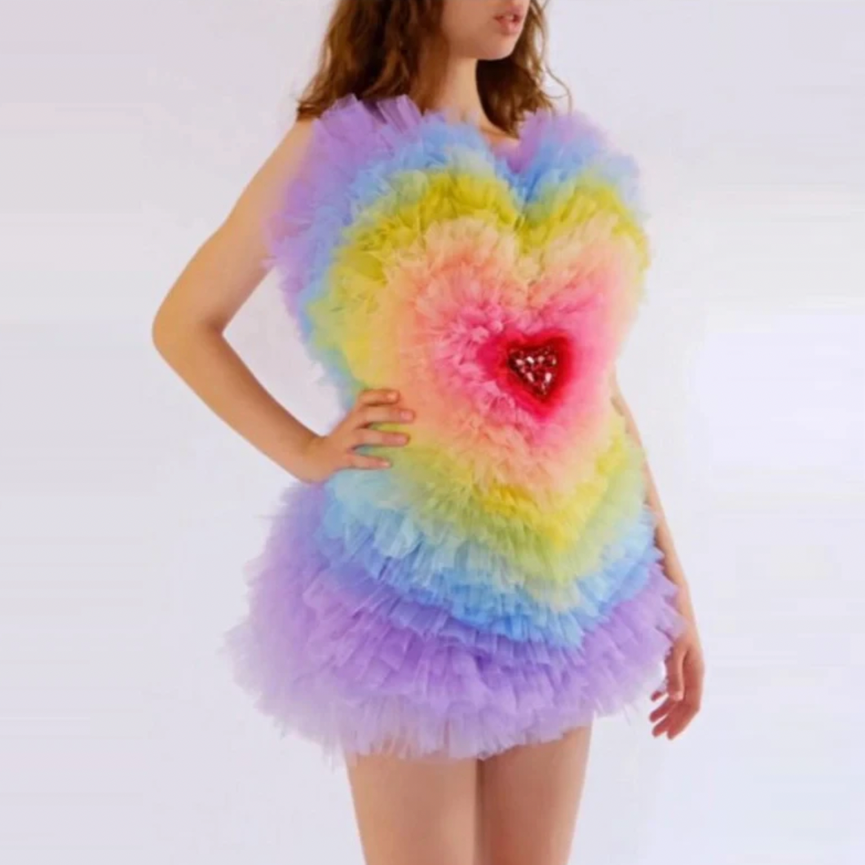 Add a touch of color and vibrancy to your wardrobe with our Rainbow Heart Dress Eureka. Featuring an off-shoulder design and layered tulle fabric, this mini dress is perfect for birthday celebrations and photoshoots. Embrace your playful side with this puffy and colorful dress.