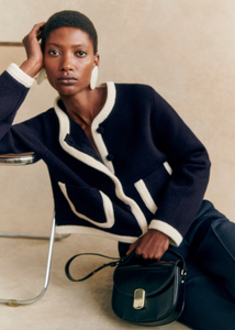 Effortlessly elevate your fall wardrobe with the Auguste Jacket. This sophisticated cardigan boasts a contrasting color detail and a sleek round neckline, exuding elegance and charm. The perfect blend of style and comfort, this knit sweater will make a statement wherever you go.