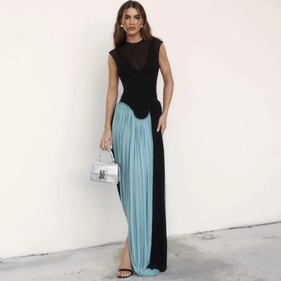 Introducing the Eileen Maxi Dress - the perfect combination of sexy and elegant. This sleeveless dress features a transparent design, perfect for a night out on the town. With its draped pleat details, you'll be sure to turn heads at any party. Embrace your inner fashionista and rock this dress with confidence.