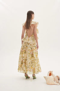 Introducing Dress Eden - the perfect blend of elegance and playfulness. Enjoy the summer breeze in this floral print long dress featuring an elegant O neck and playful sleeveless design. With charming ruffle details and flattering pleats, this dress is sure to turn heads. (Limited stock, grab yours now!)