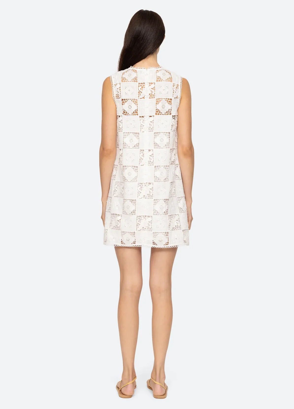 Experience elegance and beauty in the Melia Mini Dress by SEA NY. This luxurious tank dress features a delicate floral embroidered patchwork design that is both sophisticated and exclusive. Its mini silhouette adds a touch of playfulness, making it the perfect addition to your wardrobe for any occasion.