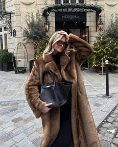 Elevate your style with the Daphne Shearling Coat. This faux fur masterpiece seamlessly blends textures and patterns for a luxurious and sophisticated aesthetic. The camel-colored coat not only adds warmth but also exudes opulence. Make a statement and elevate your wardrobe with this must-have piece.