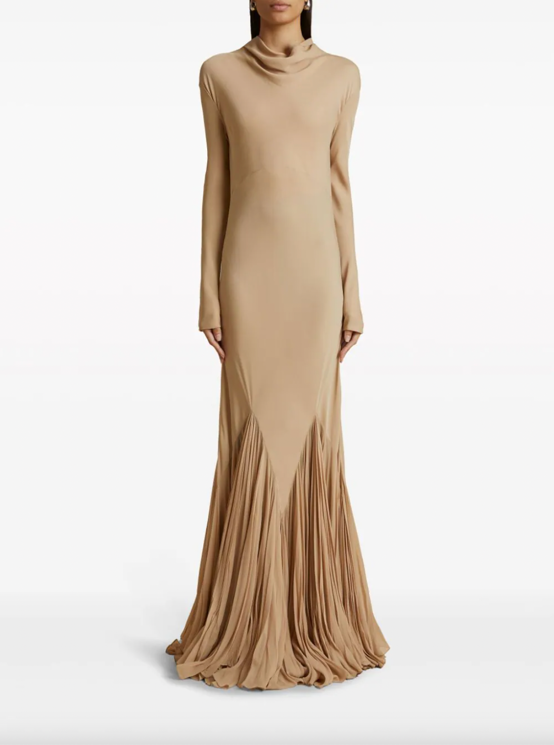 Indulge in luxury with the Metin silk maxi dress by Khaite. Crafted from fine beige silk, this exquisite dress features intricate cut-out and pleat detailing. The bias cut and cowl neck add an elegant touch, while the rear button fastening and long sleeves offer a perfect fit. The ruffle hem and floor-length design exude sophistication and grace.