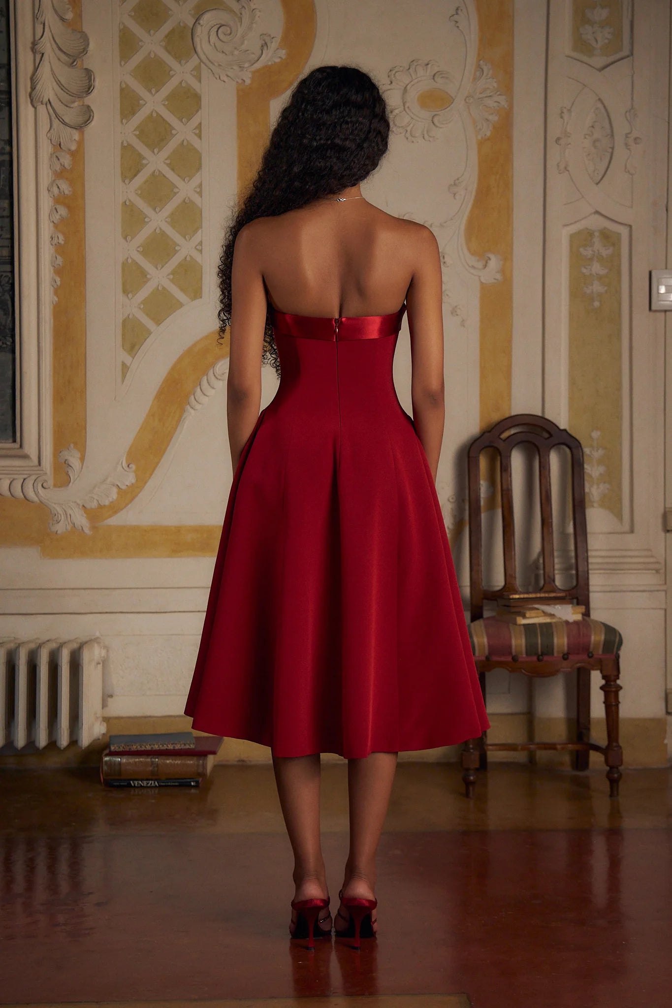 Indulge in luxury with the Scarlet Charmeuse Dress. This strapless, lady length dress boasts a fold over collar in silk charmeuse and a built-in inner bodice with silicone gripper elastic. Equipped with godets at the high hip and invisible zipper, it offers both style and convenience. Feel chic and confident with this elegant dress.