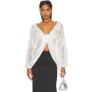 "Elevate your style with our Milk White Blouse Madeline. This sophisticated top boasts floral applique for a subtle, feminine touch and chic batwing sleeves. A must-have for any exclusive event or night out, this wrap lace top, handcrafted by Giussepe di morabito with %100 premium material, exudes luxury and class."