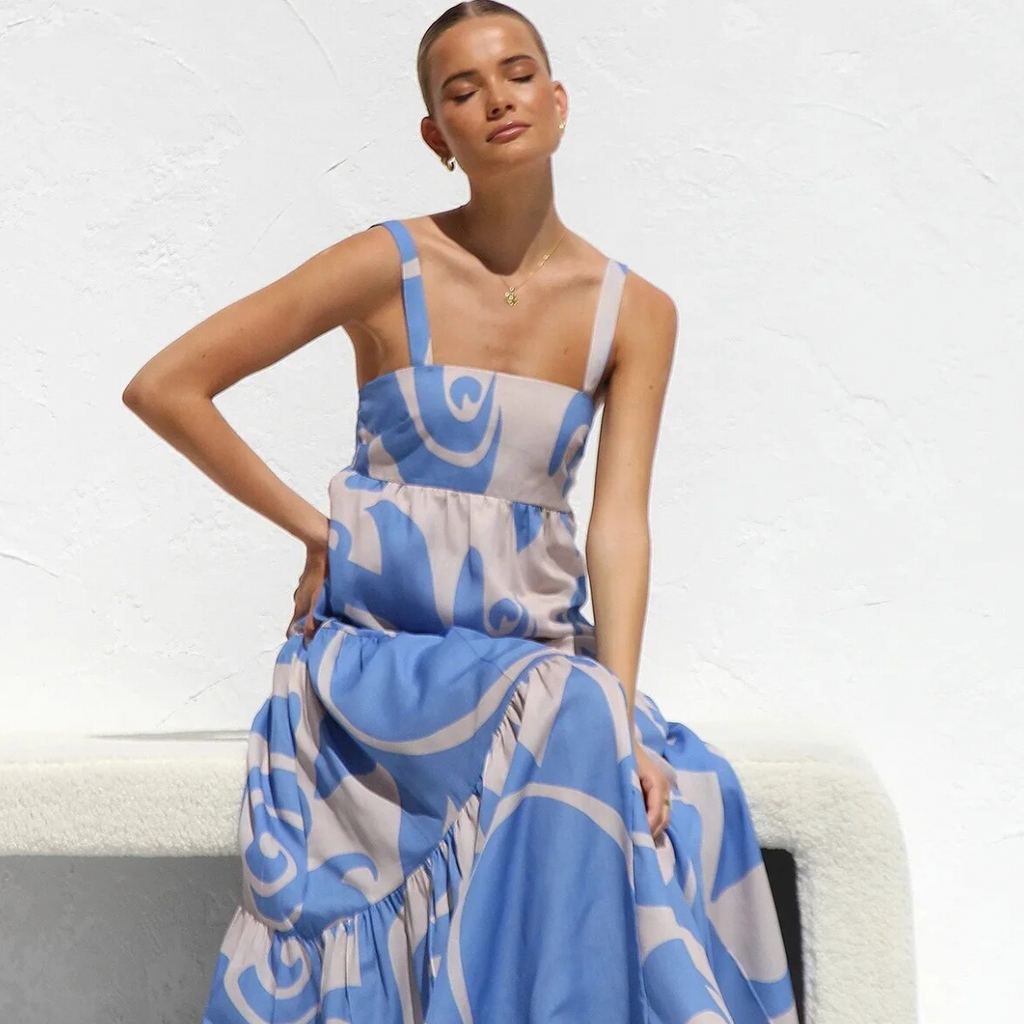 The Caprice Maxi Dress is the perfect dress for any beach party or summer holiday. Its vibrant and playful print will make a statement while its sleeveless and long design exudes elegance and charm. Stay on-trend and comfortable in this must-have fashion piece.