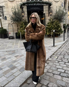 Elevate your style with the Daphne Shearling Coat. This faux fur masterpiece seamlessly blends textures and patterns for a luxurious and sophisticated aesthetic. The camel-colored coat not only adds warmth but also exudes opulence. Make a statement and elevate your wardrobe with this must-have piece.