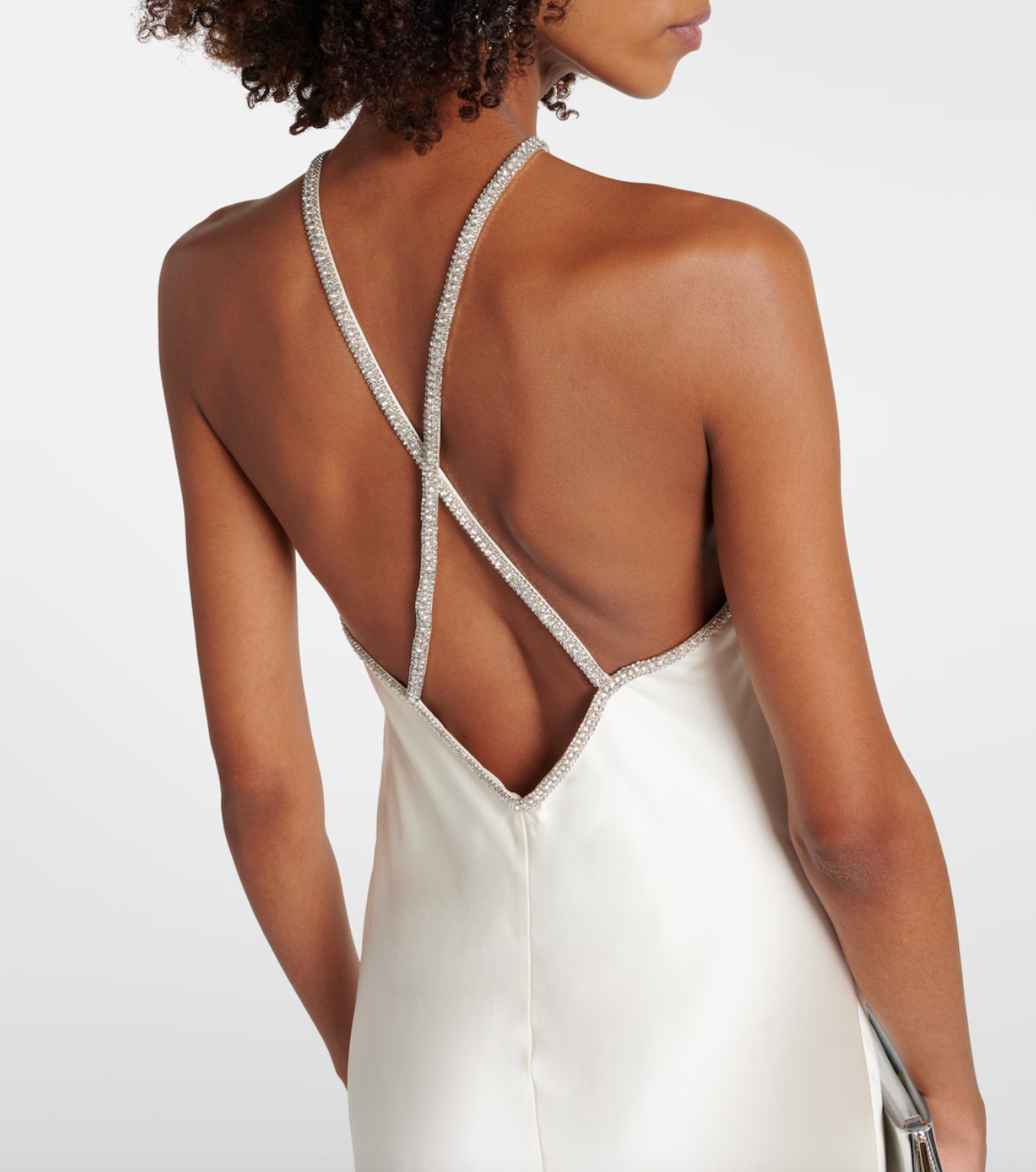 This Roland Mouret's Embellished Satin Gown exudes timeless sophistication. Made of luxurious silk satin, it features a stunning open back with lace-up detail and elegant A-Line silhouette. Perfect for any special occasion, this halter gown is designed to make you feel confident and beautiful.