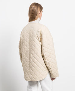 Elevate your wardrobe with the TOTEME drop-shoulder diamond-quilted jacket. Crafted from original cotton material, this jacket boasts a luxurious diamond texture and a chic snap button design. The perfect combination of style and comfort, this coat is a must-have for any fashion-forward individual.