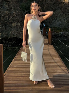 Introducing the Samantha Dress, a stunning addition to your wardrobe. Crafted from luxurious white satin, this elegant dress exudes sophistication and grace. Perfect for special occasions, it's the perfect choice for those looking to make a statement. Elevate your style with the Samantha Dress.