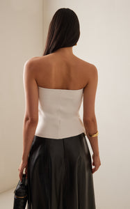 Expertly crafted from smooth stretch-crepe, the Sculpted Tube Top by House of Dagmar is a must-have for any fashion-forward individual. The strapless design boasts a gathered bust for a uniquely ruffled effect, adding a touch of effortless elegance to any outfit. Experience the perfect blend of style and comfort with this versatile top.