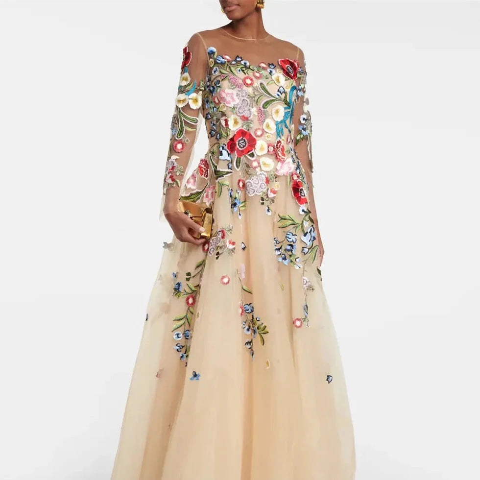 Take on the night with daring confidence in our Robe Marissa! This bold prom evening dress features long sleeves, a round neck, and stunning tulle applique with sheer details. Its floor-length design will make you stand out and make a statement. Embrace your adventurous side and make a lasting impression at your next event.