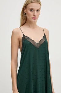 Indulge in utter opulence with the Zadig & Voltaire Risty Silk Dress. Crafted from rich emerald silk, this exquisite maxi dress boasts a charming jacquard wings pattern and intricate lace detailing. The alluring v-neckline, slim non-adjustable straps, and asymmetrical hemline only add to its allure.