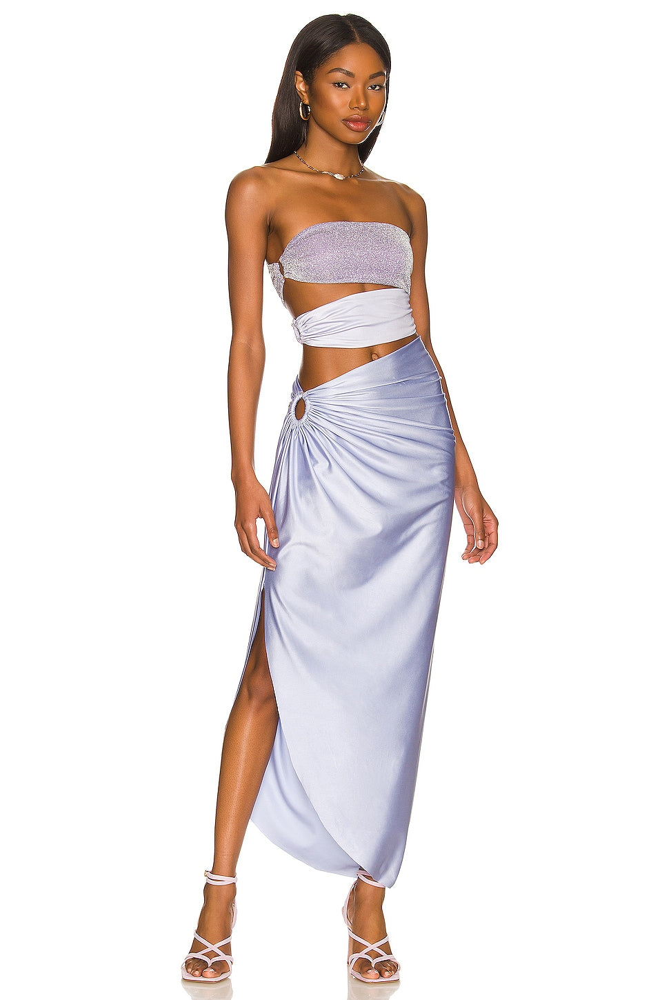 Discover effortless elegance with the Ensemble Isla collection. The BAOBAB - Isla Maxi Dress is perfect for any occasion, with a stunning cutout design and shiny texture. Also included is a New Pearl Shoulder Strap One Piece Swimsuit and Skirt, offering style and coverage for your summer swimwear. Elevate your beachwear with this versatile and chic bathing suit.