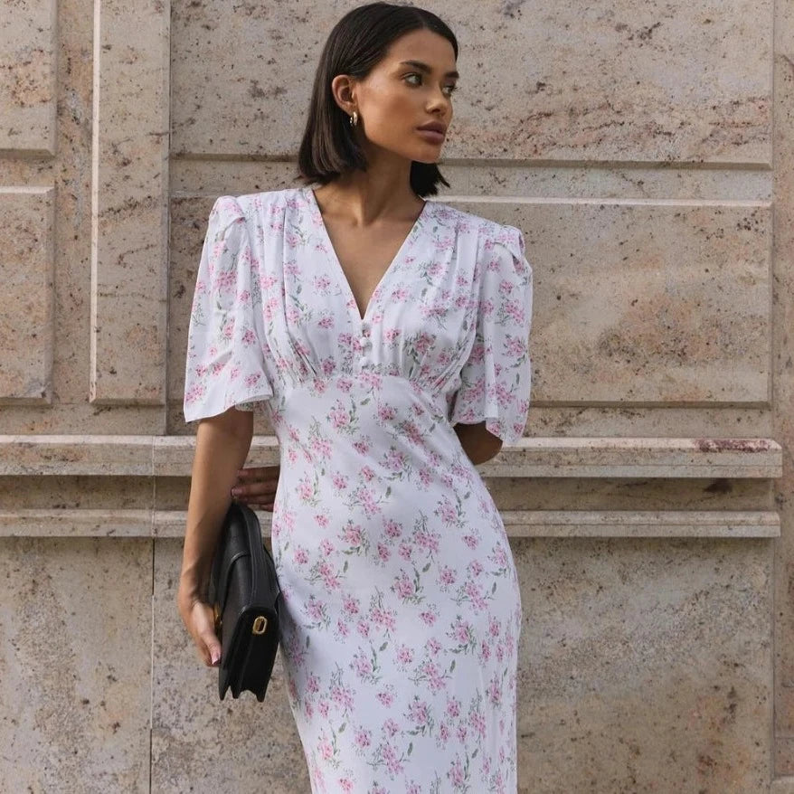 Feel confident and fashionable this summer with the Etia Dress. This V-neck dress features a slim fit, short sleeves, and a stylish printed design. Look and feel your best while staying cool and comfortable in this must-have dress.