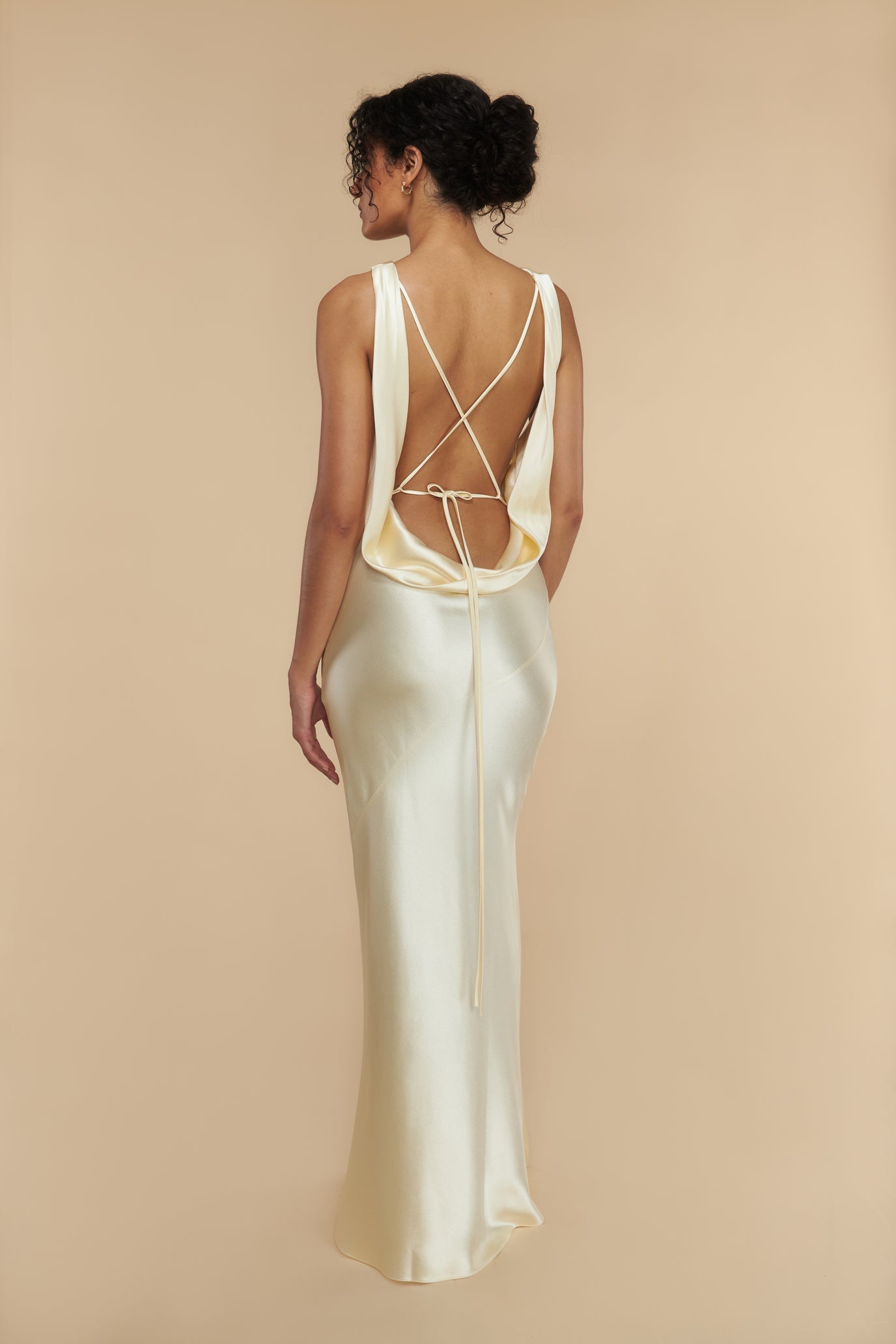 Indulge in sophistication and allure with our Elowen Evening Robe. This elegant and sexy dress features a stunning open back, delicate spaghetti straps, and a solid color design. Perfect for making a statement at any formal event.