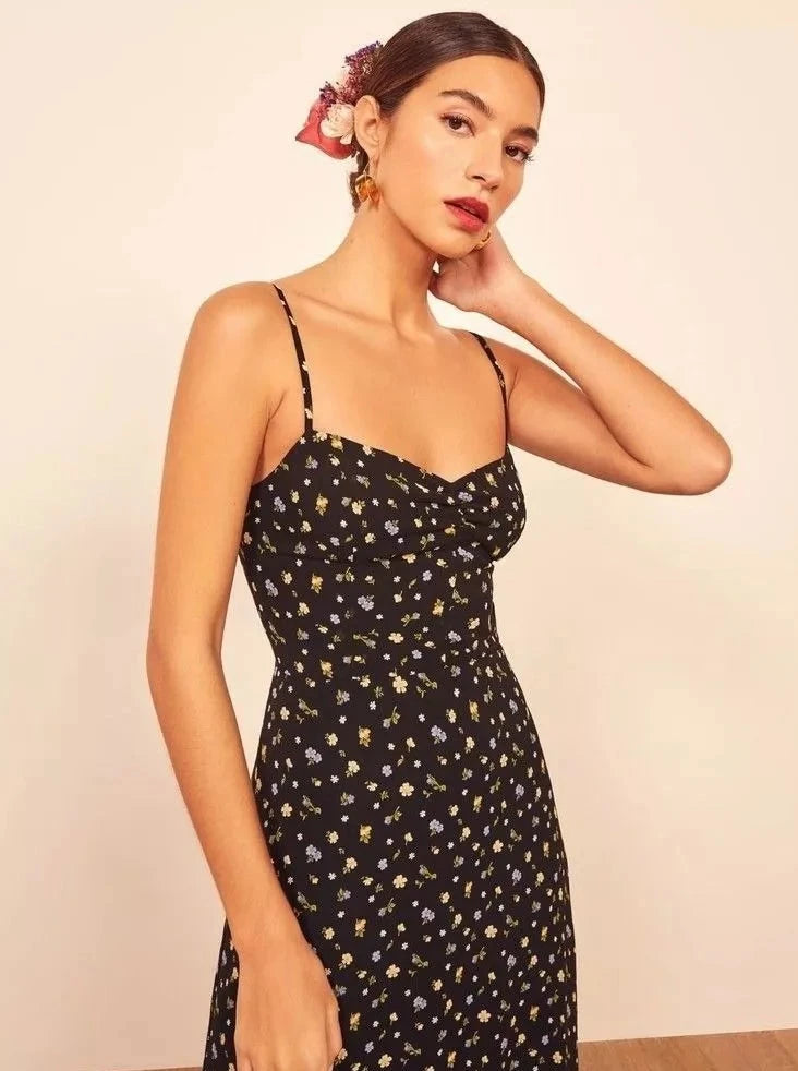 Upgrade your summer wardrobe with our Crimini Slip Dress! This elegant midi dress features a sweetheart neckline, delicate spaghetti straps, and a flirty ruffled hem. Perfect for any occasion, its vintage floral print adds a touch of sophistication. Get ready to turn heads and feel confident in this stylish and versatile dress.