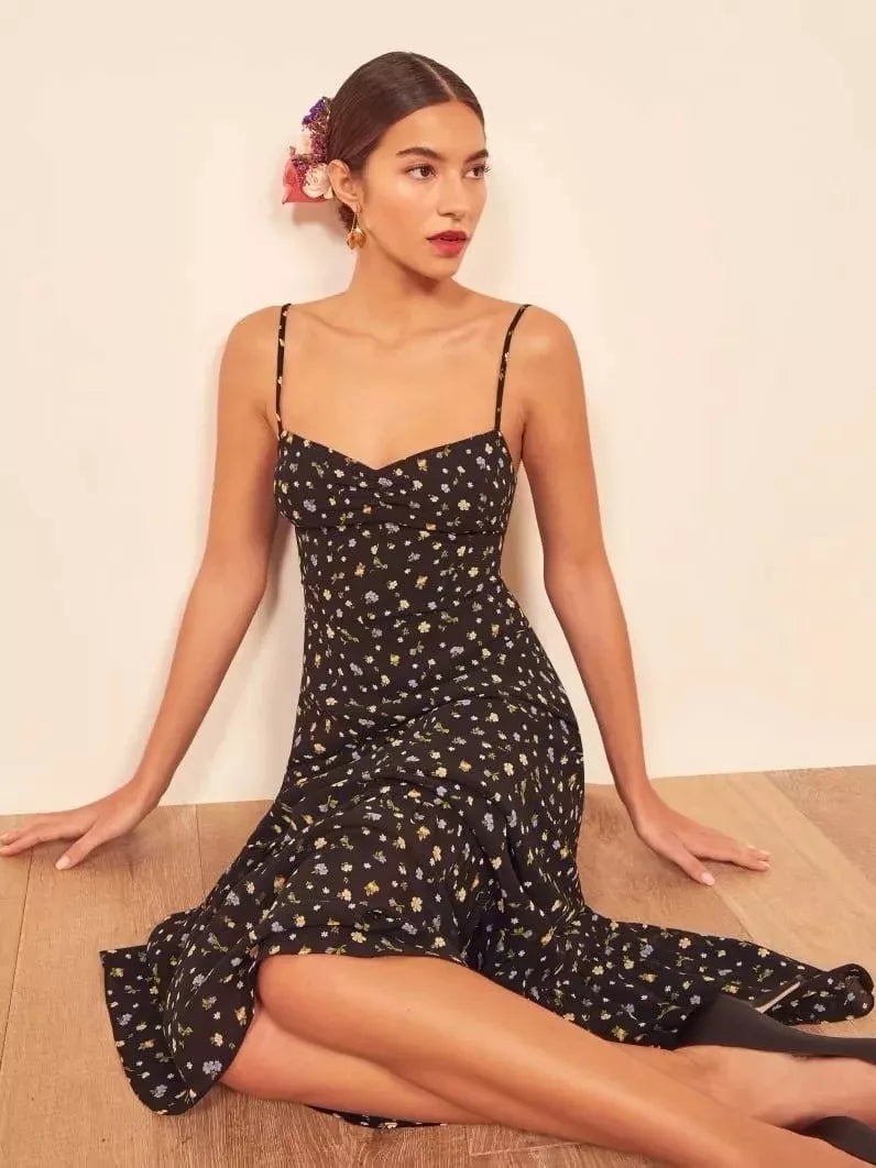 Upgrade your summer wardrobe with our Crimini Slip Dress! This elegant midi dress features a sweetheart neckline, delicate spaghetti straps, and a flirty ruffled hem. Perfect for any occasion, its vintage floral print adds a touch of sophistication. Get ready to turn heads and feel confident in this stylish and versatile dress.