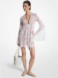 Indulge in vintage glamour with the Floral Lace Flare-Sleeve Empire Dress by Michael Kors. This mini dress features dramatic bell sleeves, an empire waist, and a plunging neckline for a feminine silhouette. Embrace the boho-chic trend by pairing it with delicate sandals and a bucket bag.