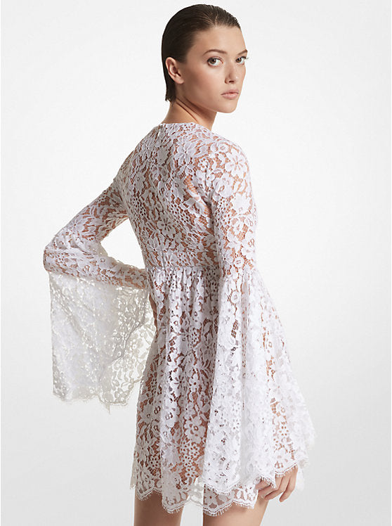 Indulge in vintage glamour with the Floral Lace Flare-Sleeve Empire Dress by Michael Kors. This mini dress features dramatic bell sleeves, an empire waist, and a plunging neckline for a feminine silhouette. Embrace the boho-chic trend by pairing it with delicate sandals and a bucket bag.