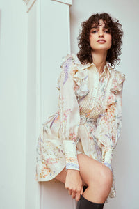 Indulge in luxury with the Bouquet Mini Dress. Made from premium silk-linen, this&nbsp; favorite features a flattering button-up design, blouson full-length sleeves with pearlised cuff buttons, and a detachable belt for a playful touch. A perfect mini-length with a side zipper opening completes the elevated look.