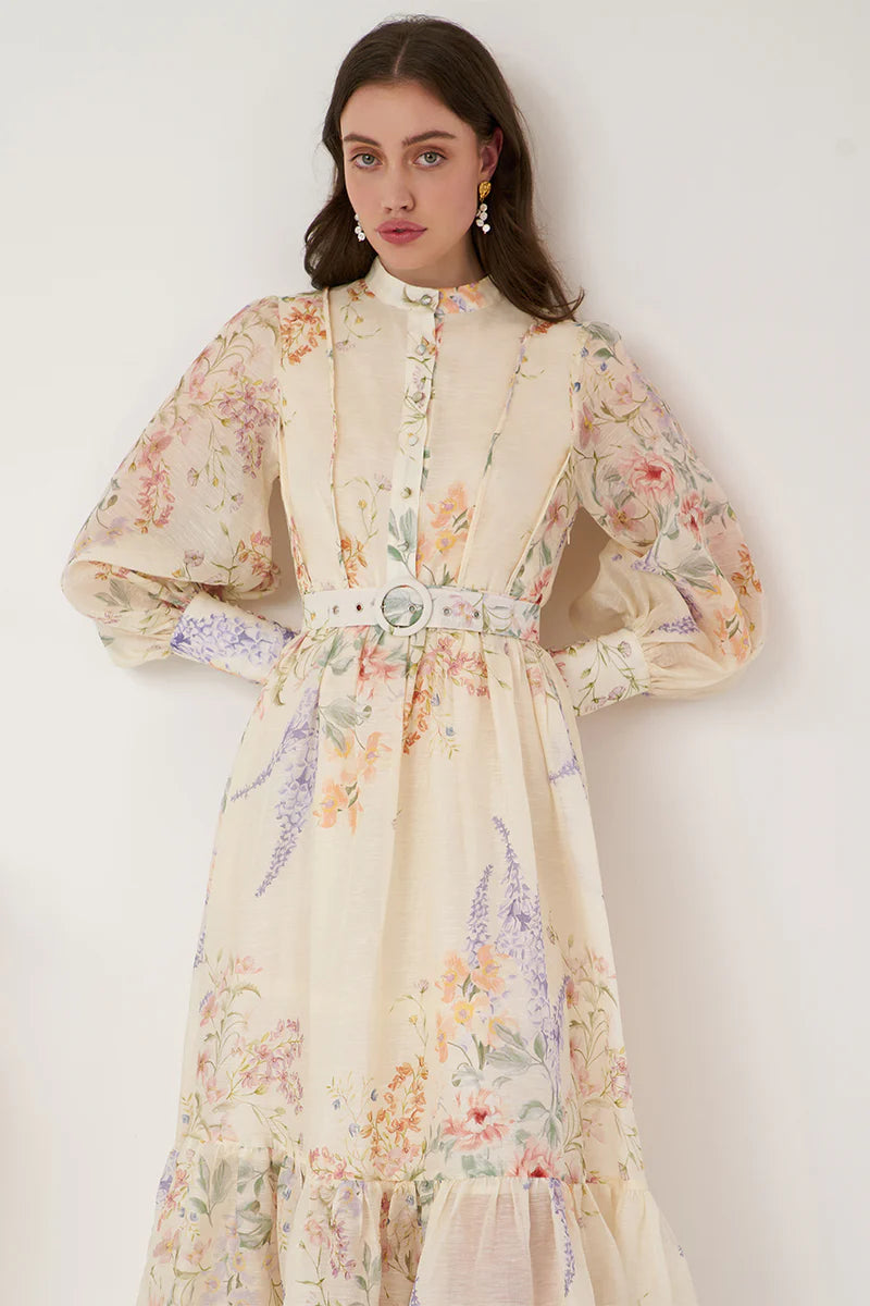 This season's Standout item - The Primrose Silk Maxi Dress in a classic button through panelled front design with a flattering mandarin collar and self fabricated belt complimented by wide full-length blouson sleeves and a maxi length skirt all crafted in premium quality silk-linen fabrication.