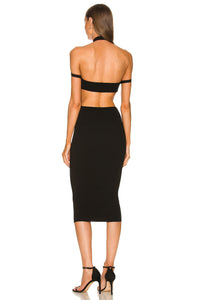 Introducing the Naomi Dress, the perfect addition to your summer wardrobe. This elegant midi dress features a flattering v-neckline and cut out details, enhancing your curves and creating a stunning silhouette. With its sleeveless and backless design, this bodycon dress is perfect for any special occasion. Elevate your style with the Naomi Dress.