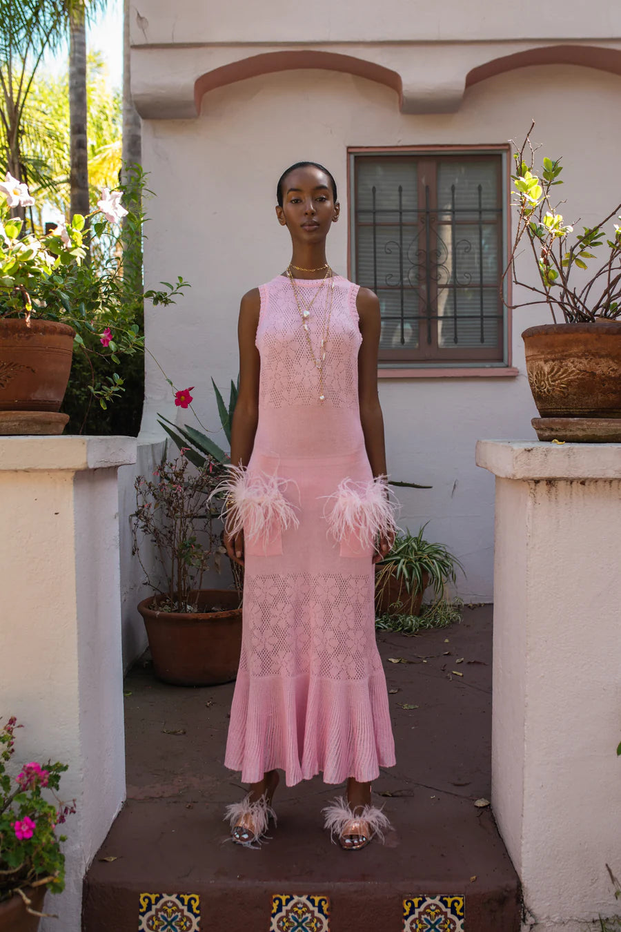 Elevate your style with the Champagne Rose Knit Dress in Pink by Andreeva! This beautiful dress features a round neck, feather details, and a figure-flattering design. Create a fabulous feminine look that is perfect for any occasion, day or night. Dress it up with heels, or keep it casual with sandals or sneakers. Stand out and feel confident in this chic dress!